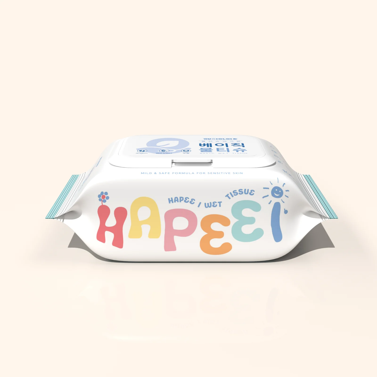 크림색 배경에 놓인 흰색 해피아이 베이직 물티슈